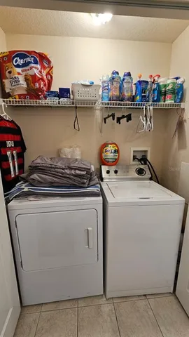 a bedroom with a bed and a tv