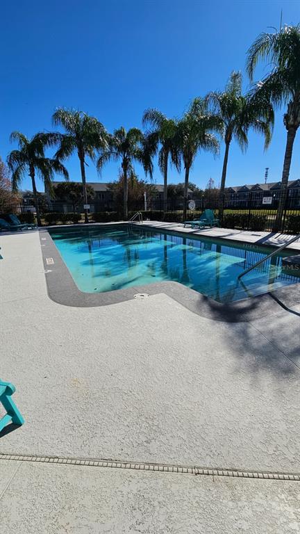 10193 Ridgebloom Avenue Orlando, FL 32829 - Photo 34 of 41 a view of swimming pool with outdoor seating and yard