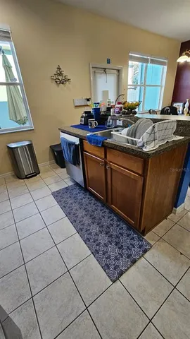 a living room with hard wood flooring and a table