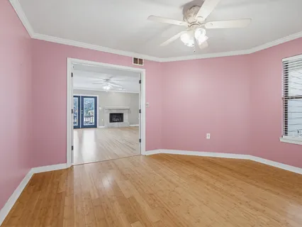 a view of an empty room with glass door