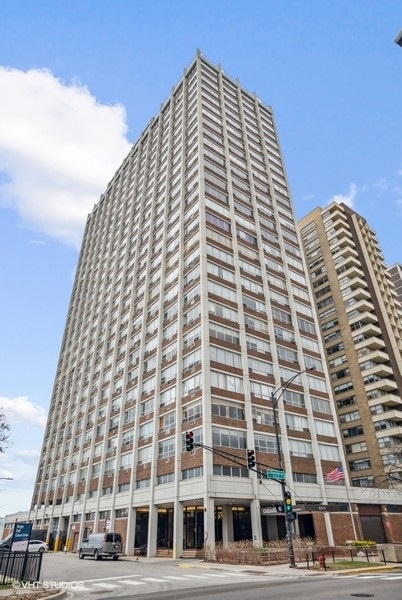 6171 North Sheridan Road, Unit 1204 Chicago, IL 60660 - Photo 1 of 15 a front view of a tall building