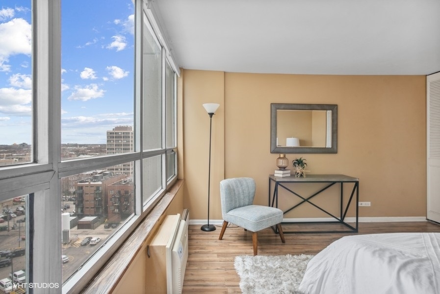 6171 North Sheridan Road, Unit 1204 Chicago, IL 60660 - Photo 11 of 15 a bedroom with furniture and a window