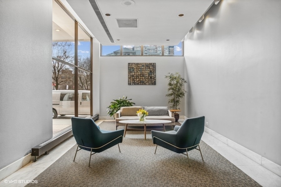 6171 North Sheridan Road, Unit 1204 Chicago, IL 60660 - Photo 15 of 15 a living room with furniture and a air conditioner vent