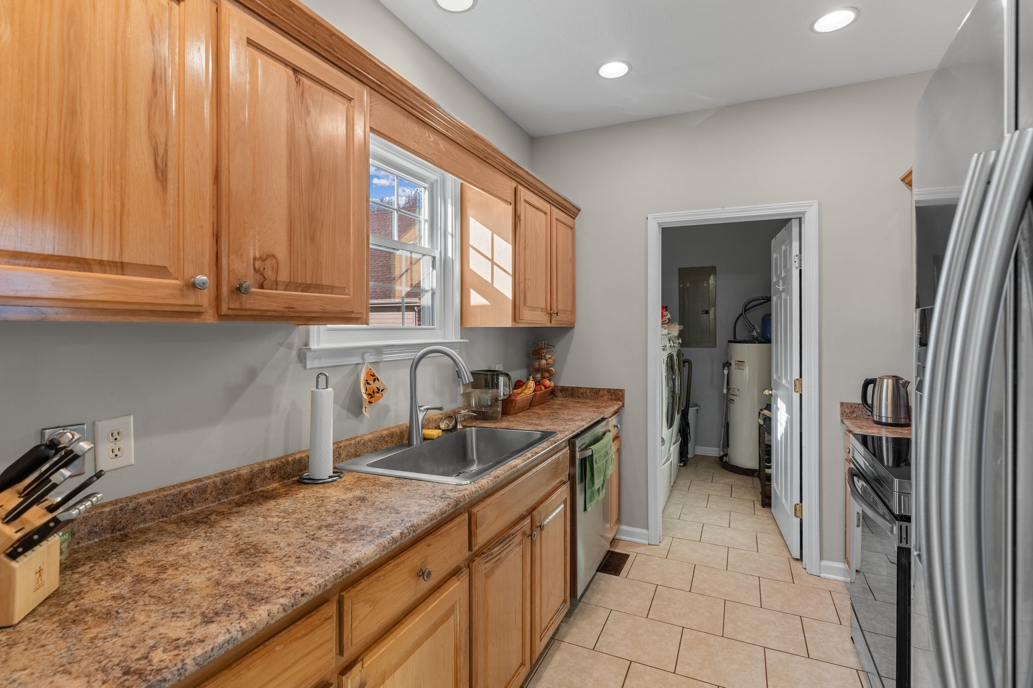 3736 Armstrong Road Springfield, TN 37172 - Photo 11 of 60 a kitchen with granite countertop a sink stove and refrigerator