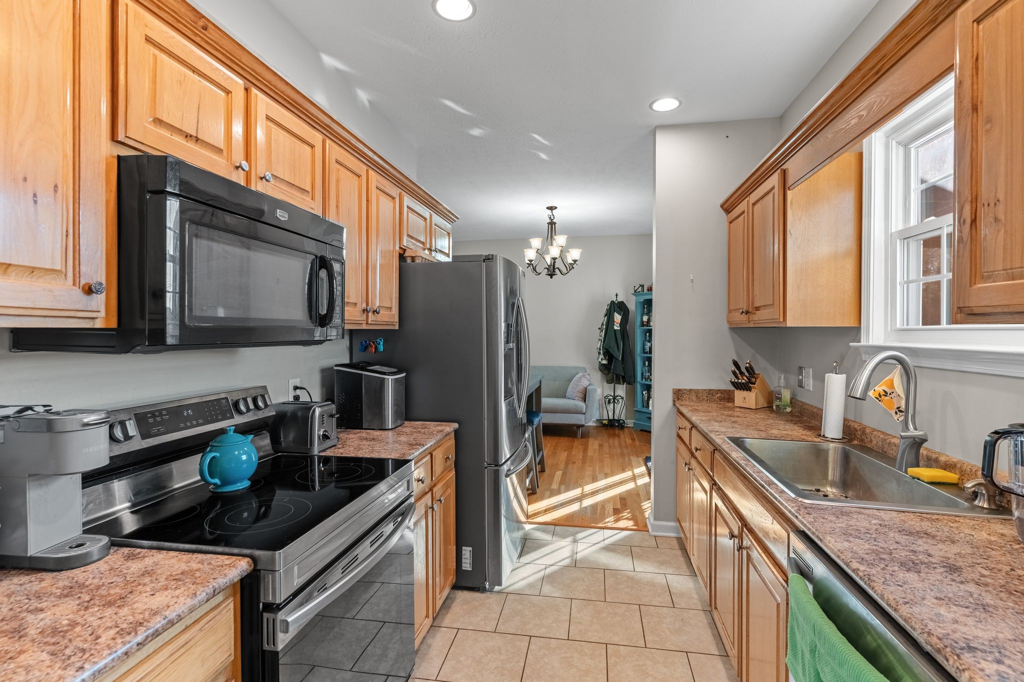 3736 Armstrong Road Springfield, TN 37172 - Photo 12 of 60 a kitchen with stainless steel appliances granite countertop a sink stove and refrigerator