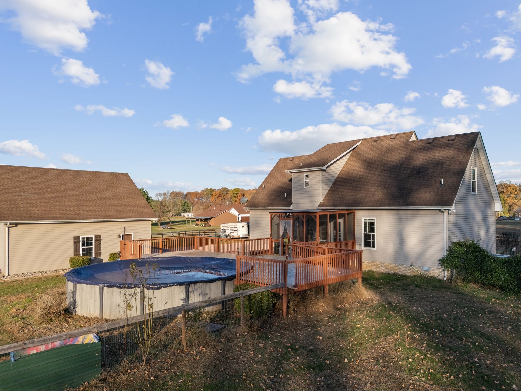 3736 Armstrong Road Springfield, TN 37172 - Photo 33 of 60 a view of a white house with a yard and table and chairs