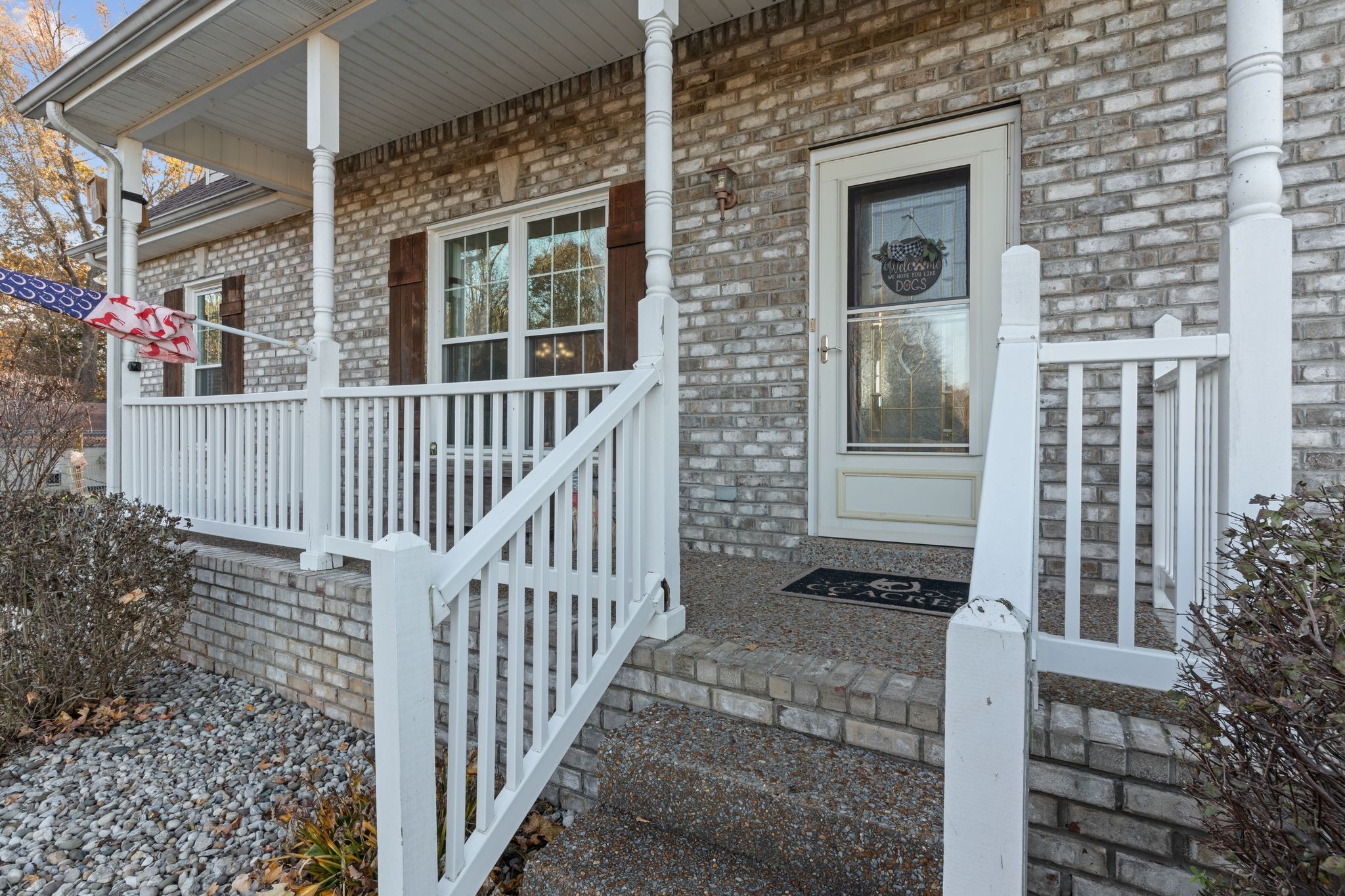 3736 Armstrong Road Springfield, TN 37172 - Photo 4 of 60 a view of a brick house with wooden fence and large windows