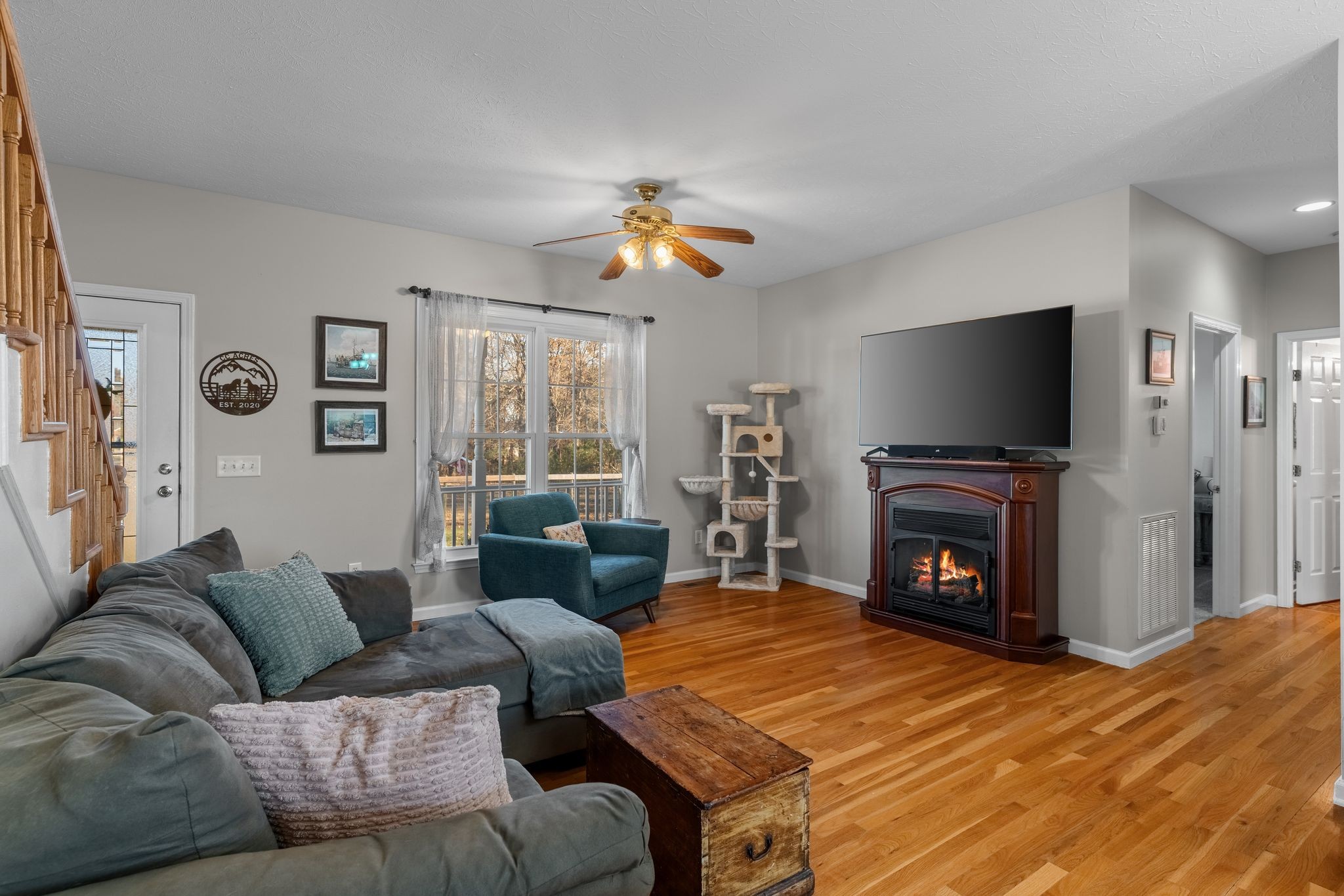 3736 Armstrong Road Springfield, TN 37172 - Photo 7 of 60 a living room with furniture a fireplace and a flat screen tv