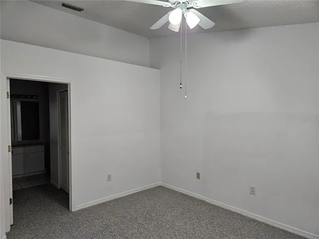 a bathroom with a sink toilet and mirror
