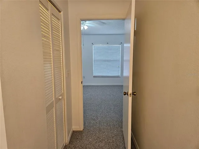 a view of a chandelier fan in a room