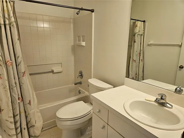 a view of a building with a palm tree