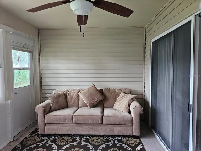 a view of a yard from a corridor