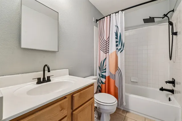 a bathroom with a sink a toilet and a bathtub