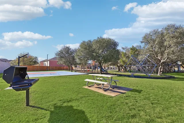 a view of a park with large trees