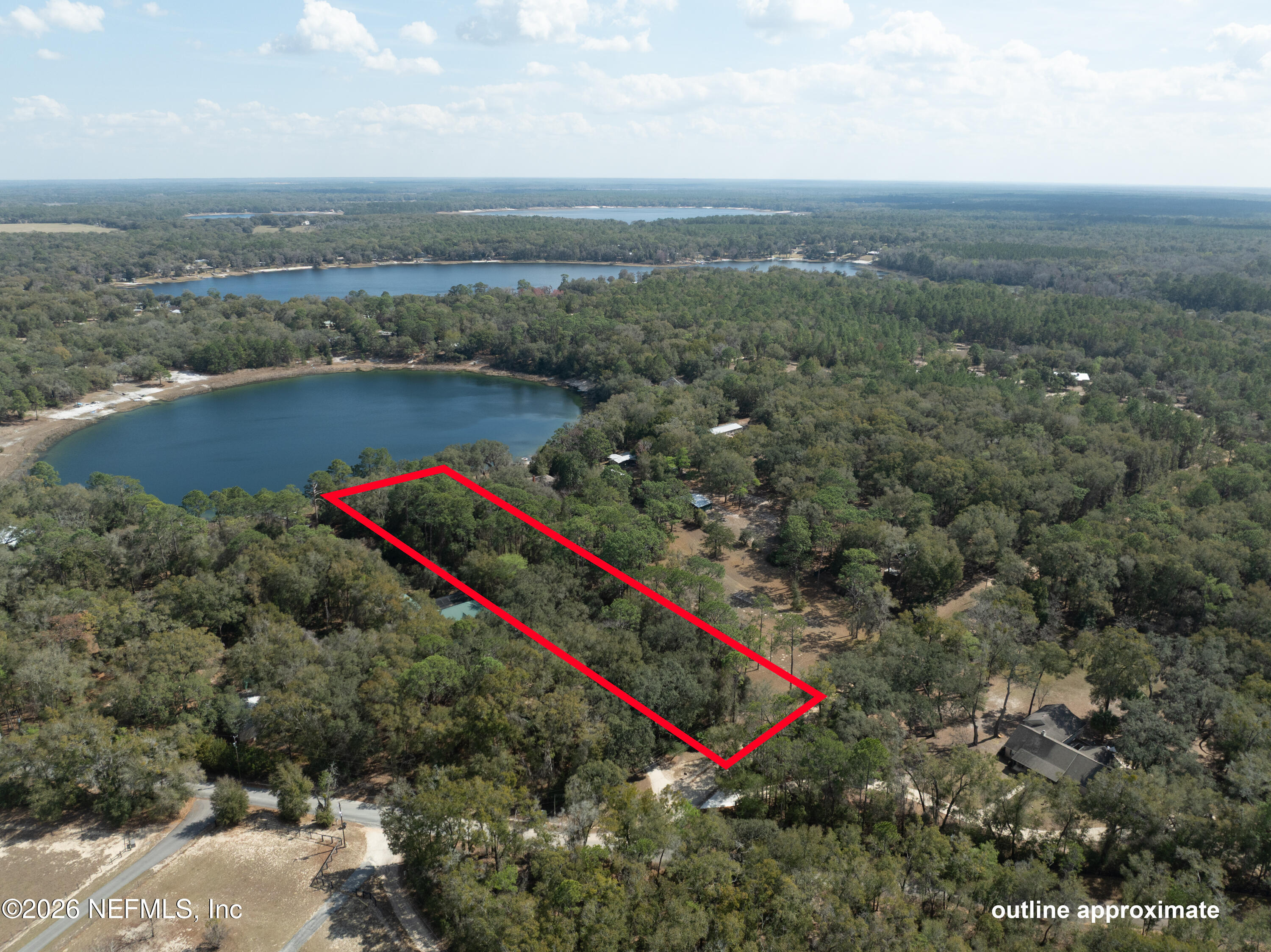 0 Lilly Lake Road Melrose, FL 32666 - Photo 6 of 7 an aerial view of a houses with a yard and lake view