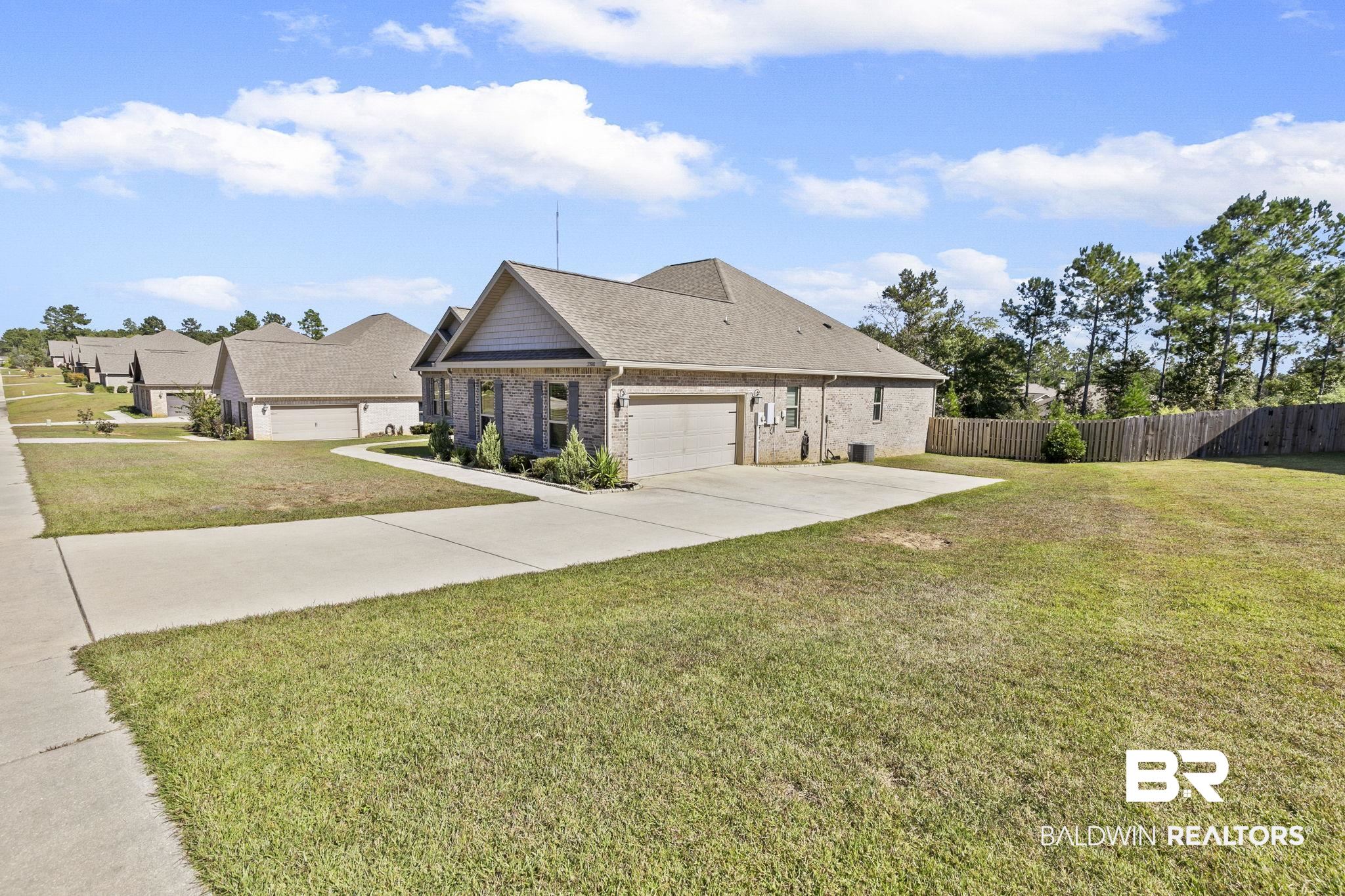 31500 Spoonbill Road Daphne, AL 36527 - Photo 3 of 85 Craftsman house with a garage and a front lawn