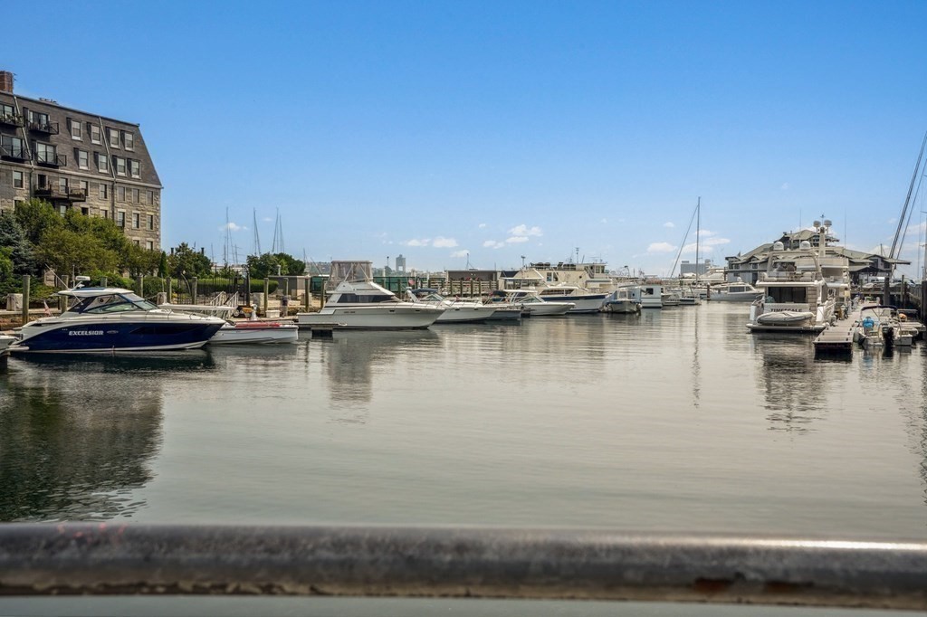 59 Fleet Street, Unit 3 Boston, MA 02109 - Photo 1 of 24 a view of a lake with boats and trees in the background