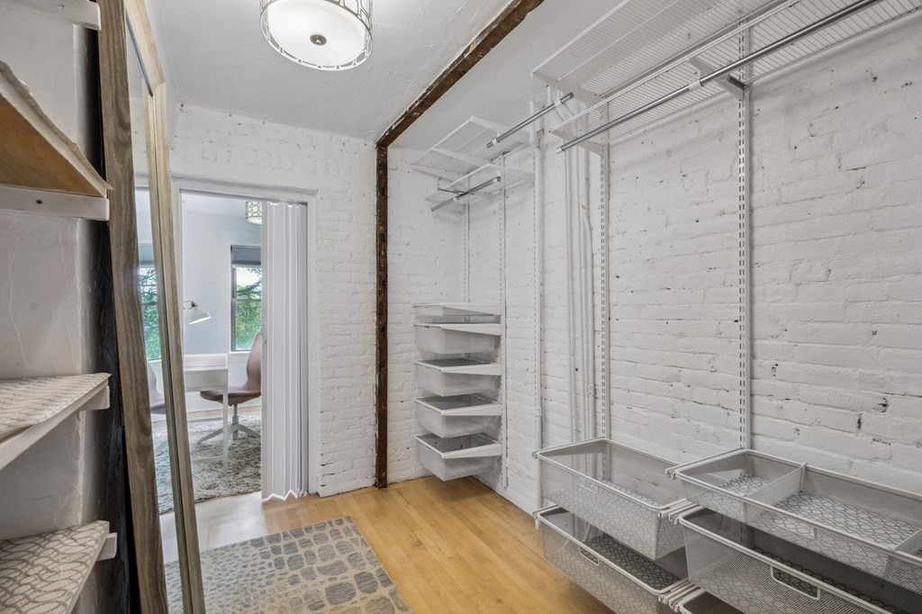 59 Fleet Street, Unit 3 Boston, MA 02109 - Photo 16 of 24 a bedroom with a bed and the view of bathroom