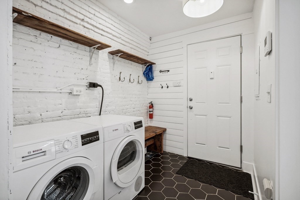 59 Fleet Street, Unit 3 Boston, MA 02109 - Photo 18 of 24 a utility room with dryer and washer