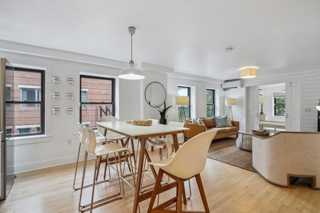 59 Fleet Street, Unit 3 Boston, MA 02109 - Photo 10 of 24 a view of a dining room with furniture window and wooden floor