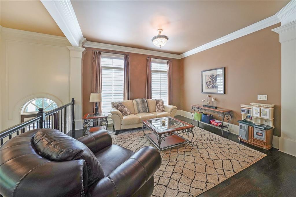 9062 Riverbend Manor Alpharetta, GA 30022 - Photo 11 of 36 a living room with furniture or couch and a window