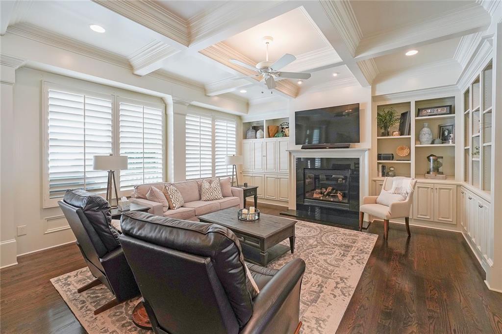 9062 Riverbend Manor Alpharetta, GA 30022 - Photo 12 of 36 a living room with fireplace furniture and a flat screen tv