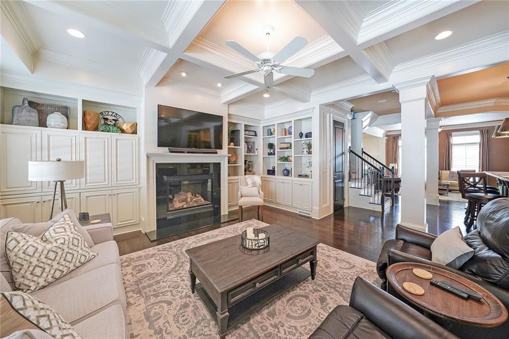 9062 Riverbend Manor Alpharetta, GA 30022 - Photo 14 of 36 a living room with furniture a flat screen tv and a fireplace