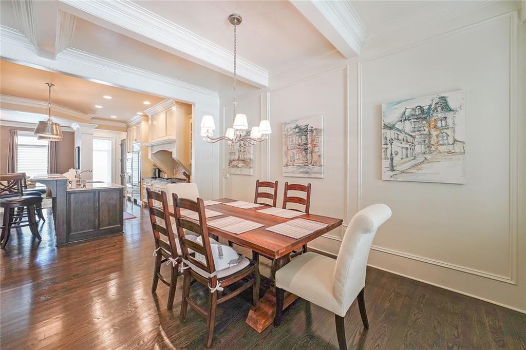 9062 Riverbend Manor Alpharetta, GA 30022 - Photo 15 of 36 a view of a dining room with furniture and wooden floor