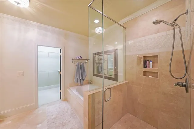 a spacious bathroom with a double vanity sink a mirror and shower