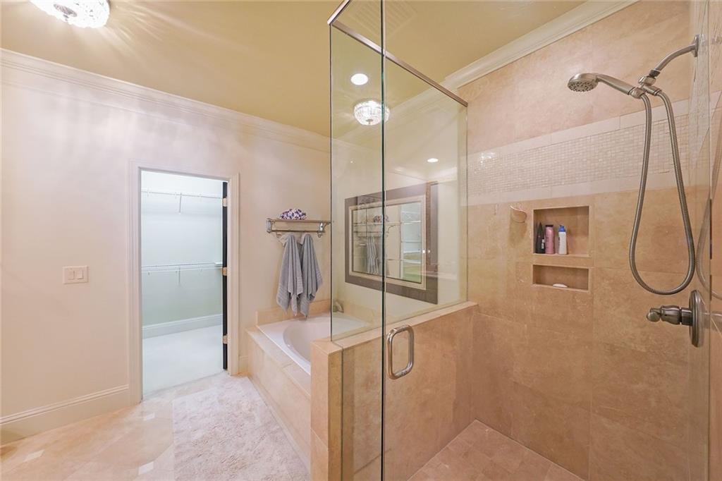 9062 Riverbend Manor Alpharetta, GA 30022 - Photo 21 of 36 a bathroom with a shower and a sink