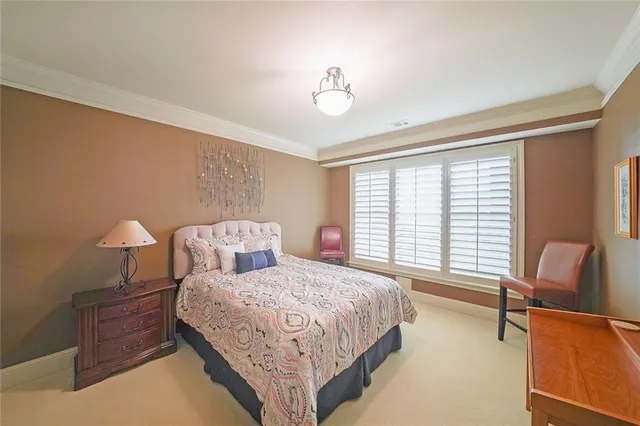 a bathroom with a sink mirror vanity and toilet