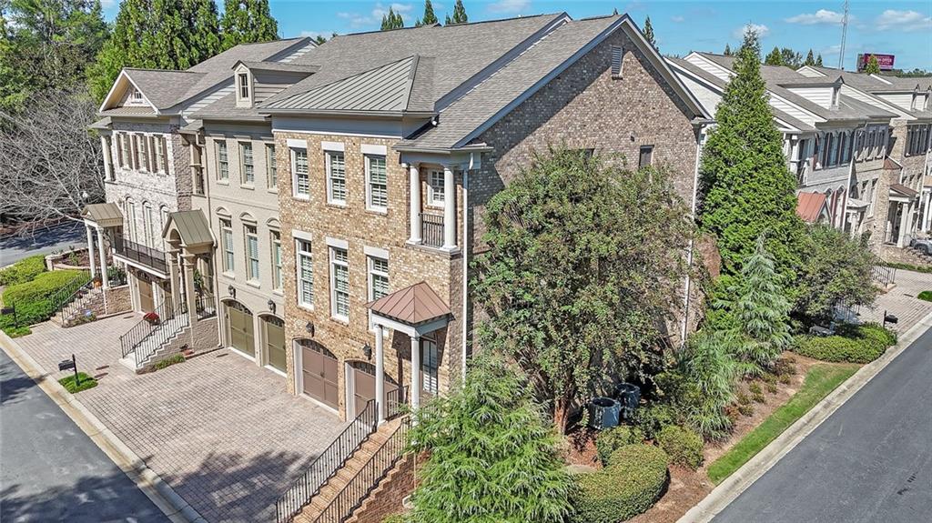 9062 Riverbend Manor Alpharetta, GA 30022 - Photo 3 of 36 aerial view of a house with a yard and potted plants