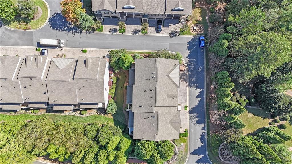 9062 Riverbend Manor Alpharetta, GA 30022 - Photo 34 of 36 an aerial view of a house with a yard and large trees