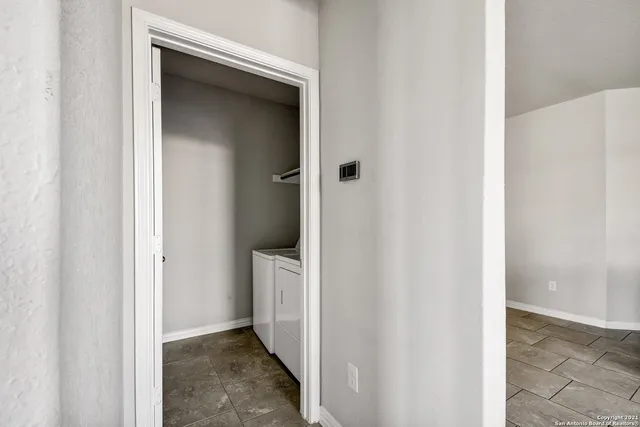 a view of a bathroom from a hallway