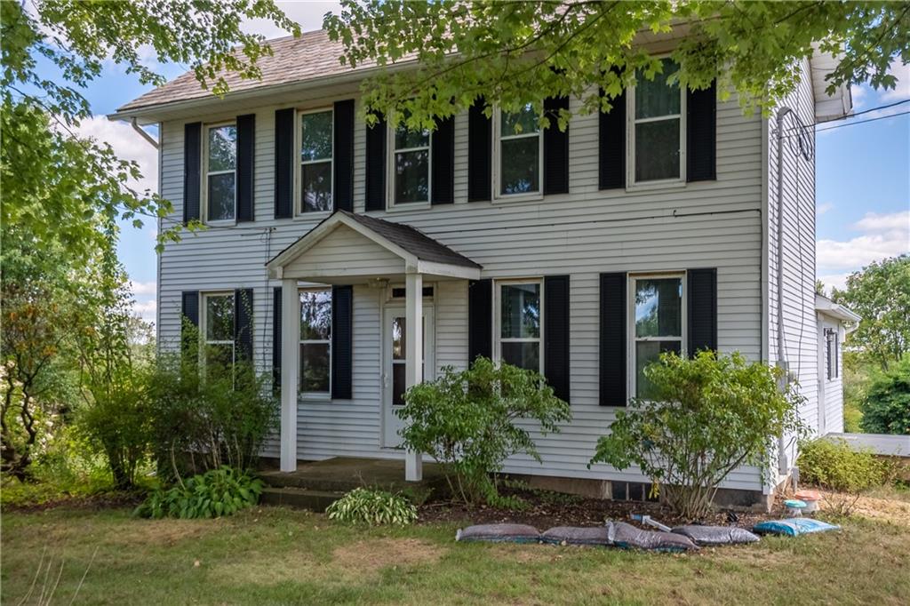 2042 Plain Grove Road Volant, PA 16156 - Photo 2 of 23 front view of a house with a yard