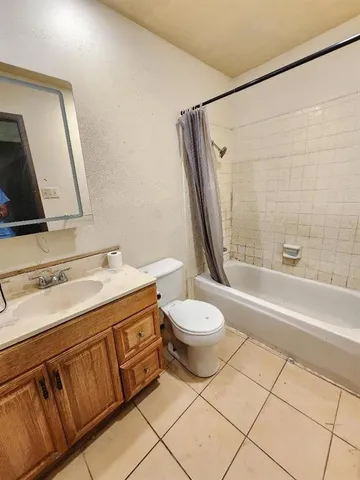 a bathroom with a sink a toilet and a bathtub