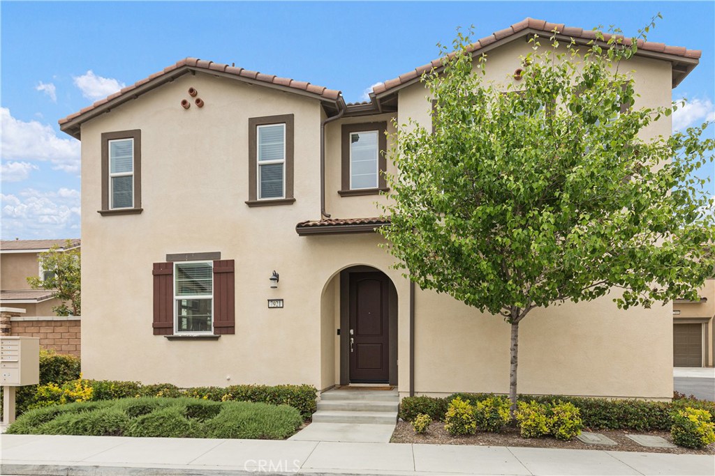 7921 Griffith Peak Street Riverside, CA 92507 - Photo 1 of 1 a front view of a house with plants