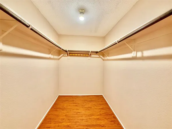a bathroom with a tub and shower