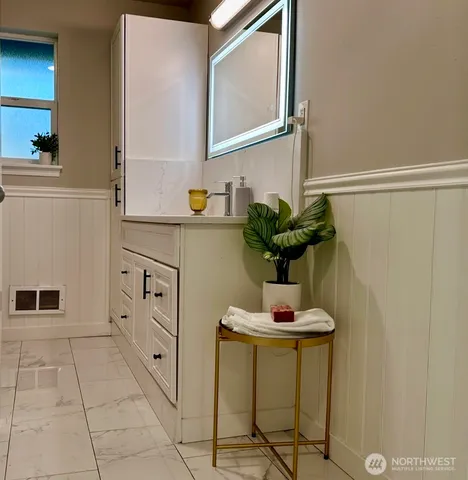 a bathroom with a sink and a mirror