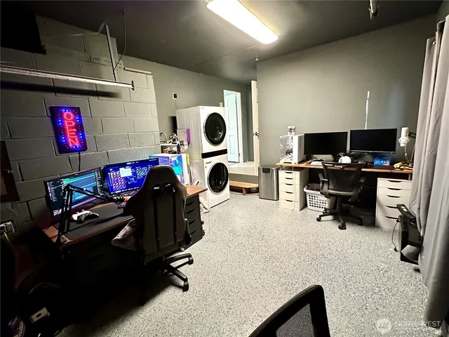 a room with gym equipment and a flat screen tv