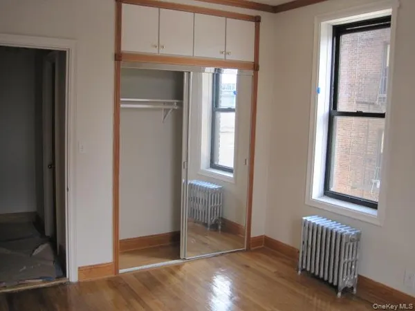 a view of an entryway with wooden floor