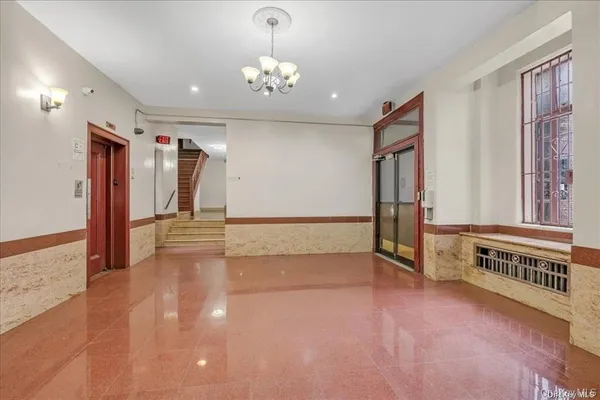 a view of a hallway with stairs