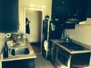 a kitchen with a sink and a stove