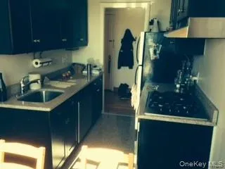 a kitchen with sink and cabinets