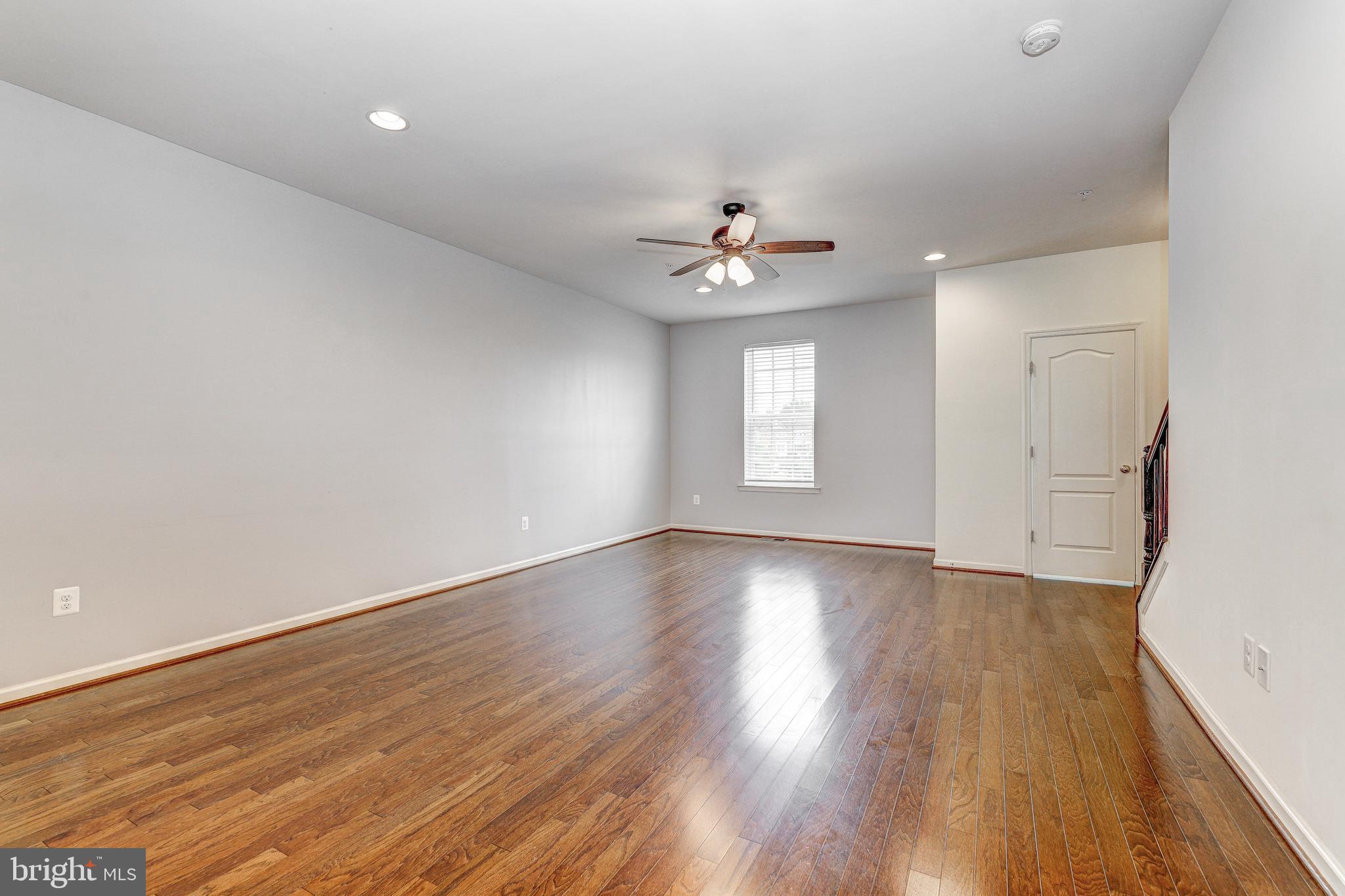 912 Winter Run Road Middle River, MD 21220 - Photo 19 of 55 wooden floor in an empty room with a window