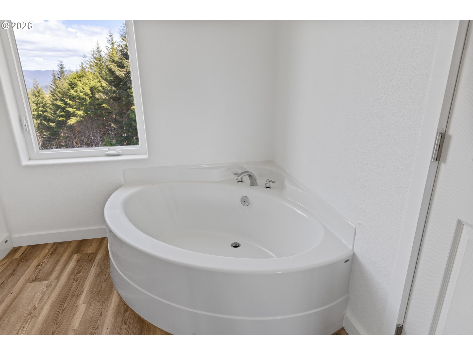 46345 Dement Creek Road Broadbent, OR 97414 - Photo 25 of 47 a white bath tub sitting in a bathroom