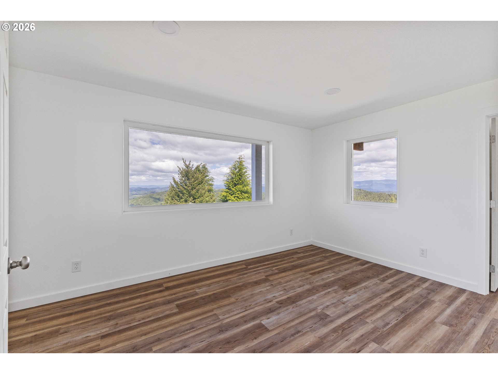 46345 Dement Creek Road Broadbent, OR 97414 - Photo 27 of 47 an empty room with wooden floor and window