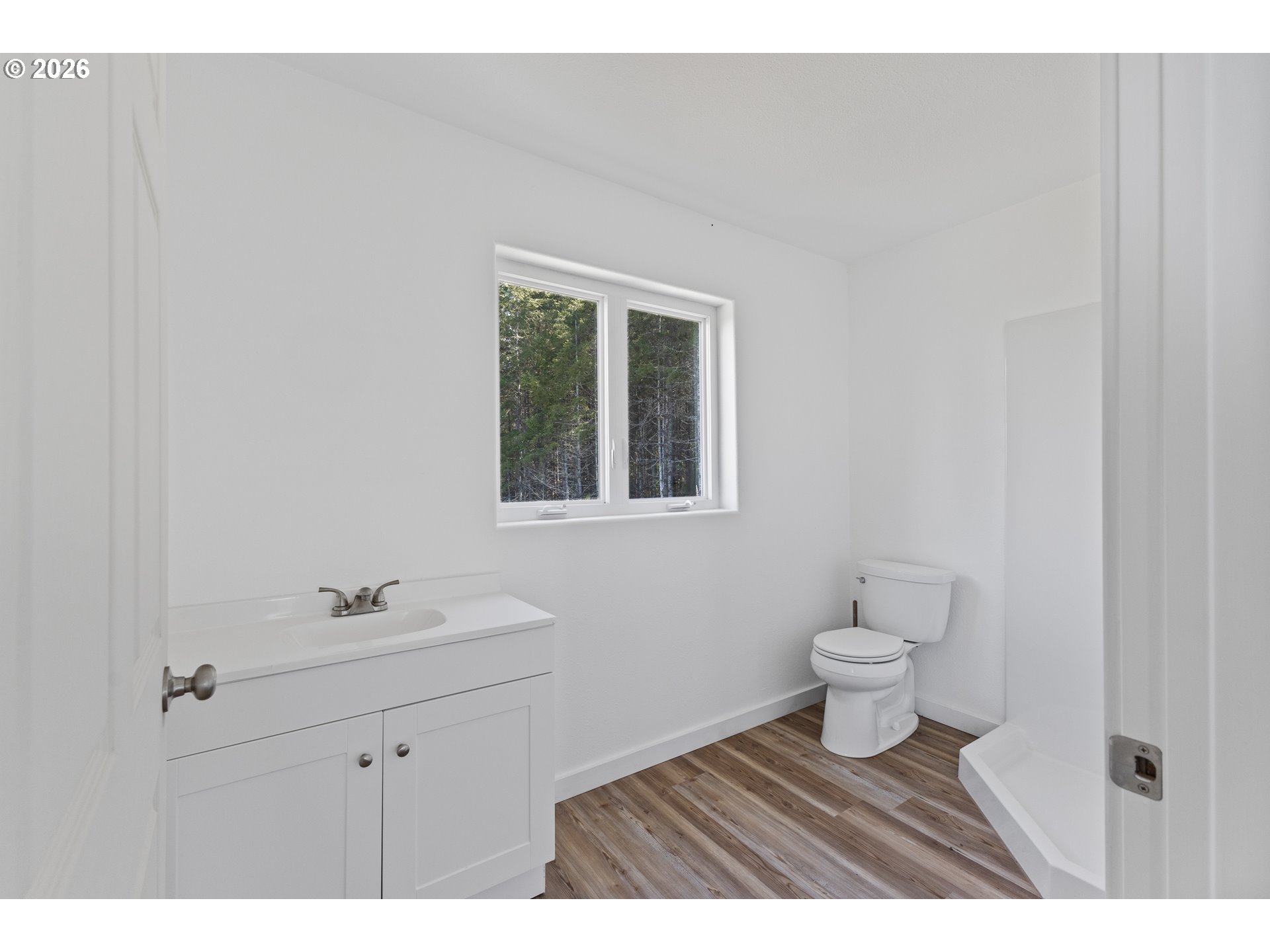 46345 Dement Creek Road Broadbent, OR 97414 - Photo 37 of 47 a bathroom with a sink a toilet and a mirror
