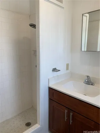 a bathroom with a sink and a shower