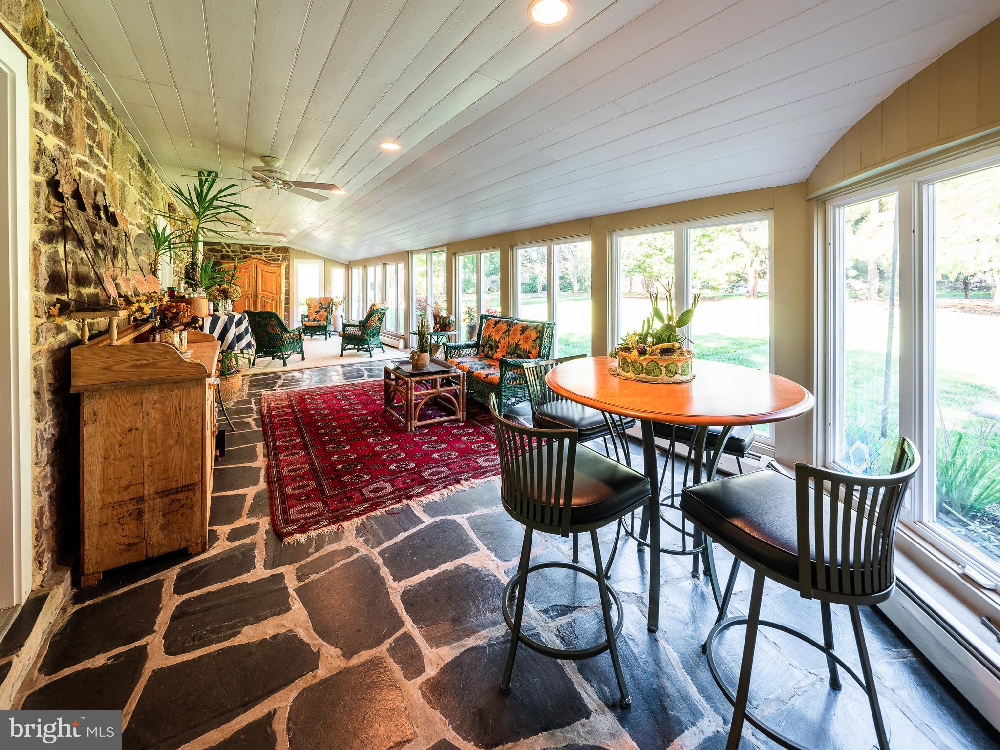 3 Belmont Way Holland, PA 18966 - Photo 41 of 82 Sunroom with stone floors, doors to the backyard
